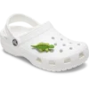 3D-charm i form av en grön dinosaurie med fjäll som Jibbitz-berlocker